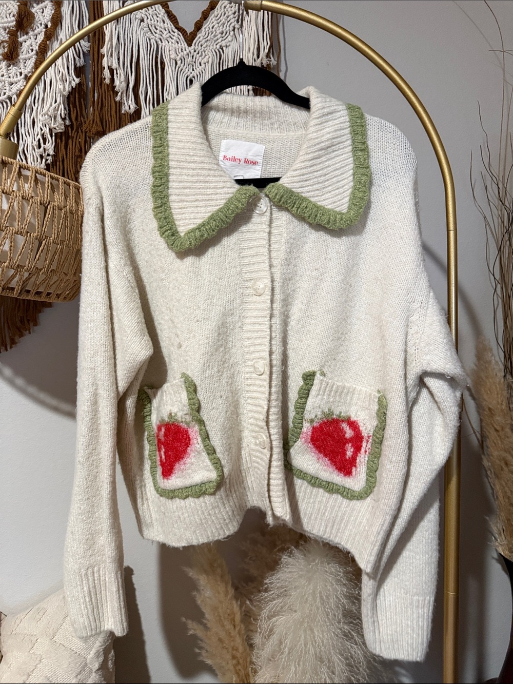 Bailey Rose Cream Cardigan with Green Trim and Red Pocket Hearts